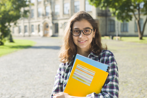 portrait-pretty-student-girl-glasses-with-books_8119-2431